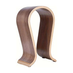 U-shaped wooden headphone stand on a plain background